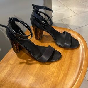 Crown, Size 8, black leather straps with faux wood detail on heels.